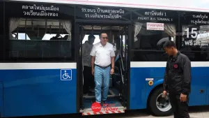 Anutin rides Phuket EV bus to promote carpooling and cut