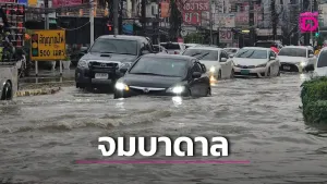 Monsoon rain leaves standing water on Phuket’s Chao Fa East Road as traffic slows