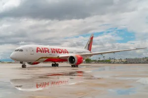 Air india aircraft cruising high above cloud layers depicting clear air turbulence concepts