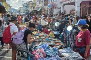 Tourists visit a walking street in the Old Town zone of Phuket. (Photo: Achadthaya Chuenniran)