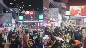 Foreign man throws banknotes into air on Phuket’s Bangla Road